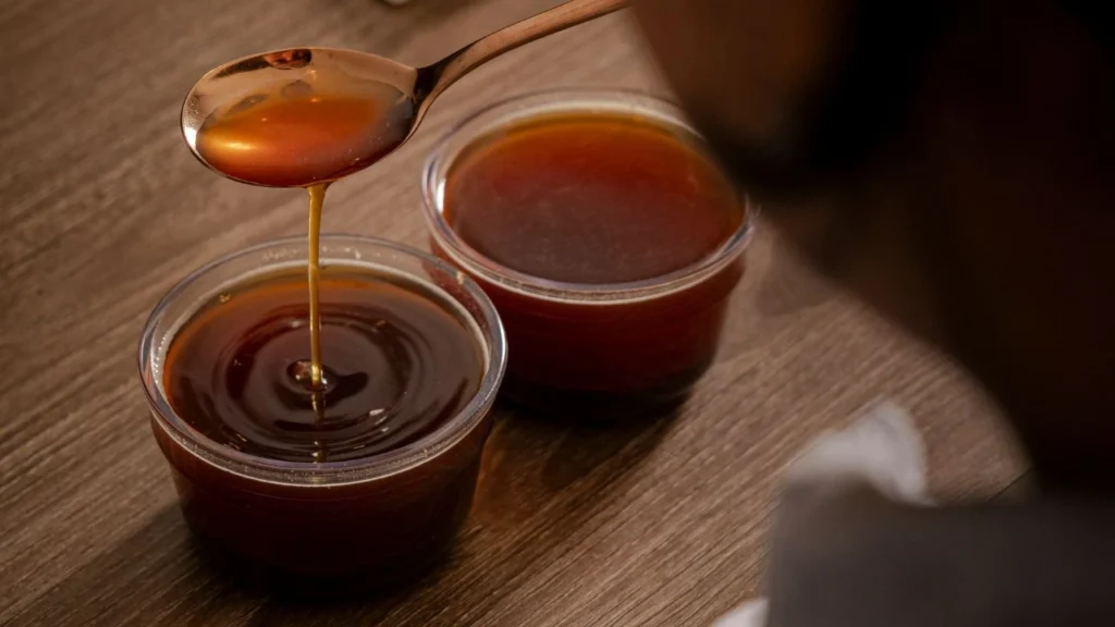 Brewed coffee being evaluated at Bali Origins, showing body, clarity, and consistency in the cup.