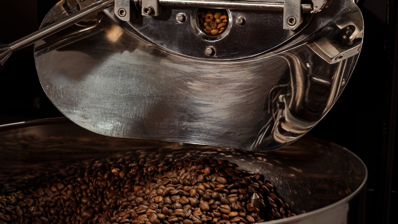 Coffee roasting process inside a roasting drum, ensuring controlled heat and consistent output