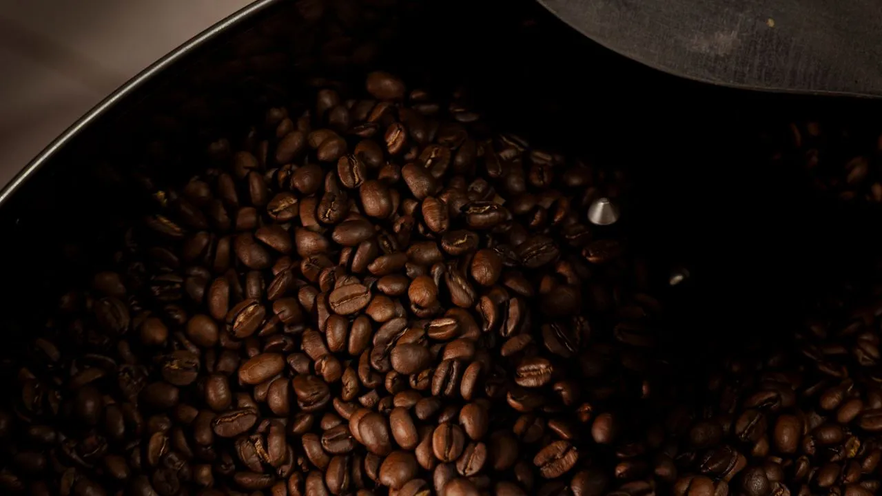 Coffee roasting process inside a roasting drum, ensuring controlled heat and consistent output