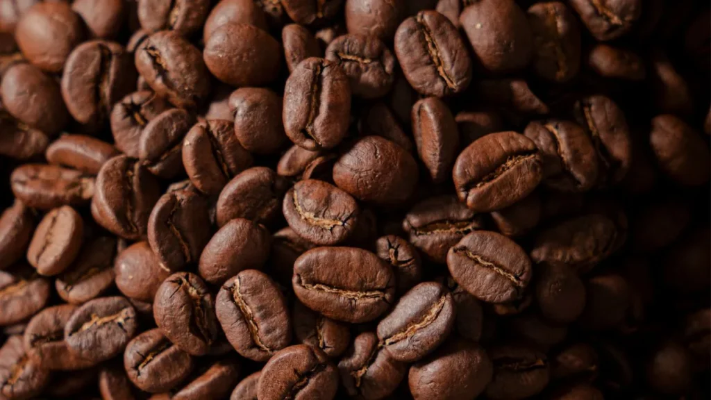 Roasted coffee beans with even color and surface texture, reflecting controlled roasting quality of coffee production indonesia